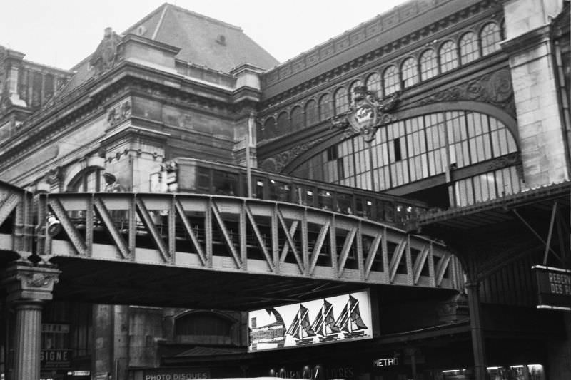 Metro crosses the Seine and cuts through SNCF station, Paris, December 1969