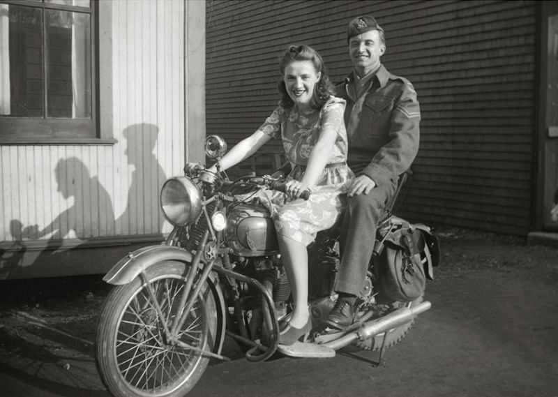Couple on a Triumph motorcycle, circa 1940s