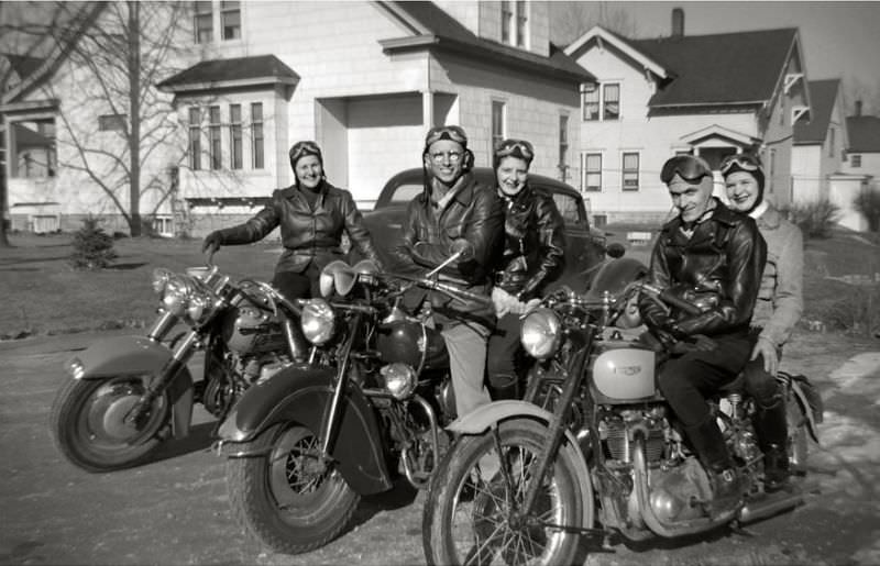 A team of motorcycles and riders, including a Triumph, Indian and Harley-Davidson, somewhere in Wisconsin, 1950s