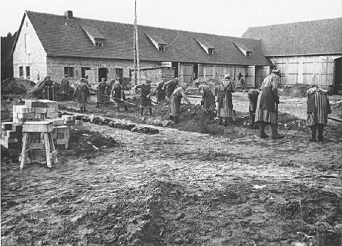 Female prisoners at forced labor digging trenches at the Ravensbrück concentration camp. This photograph is from the SS-Propaganda-Album des Frauen-KZ-Ravensbrueck 1940-1941.