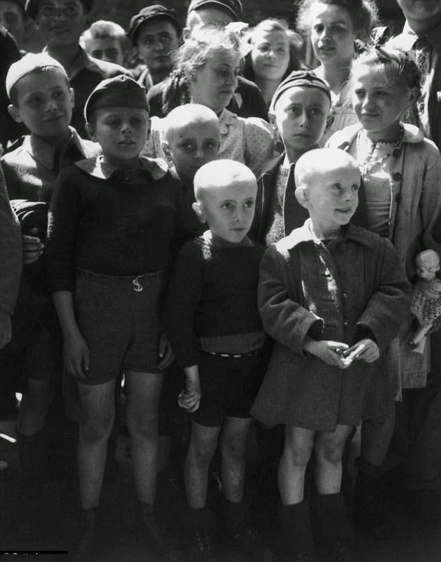 Shaven-headed children returned from the Ravensbruck concentration camp seen after its liberation by the Russians in 1945.