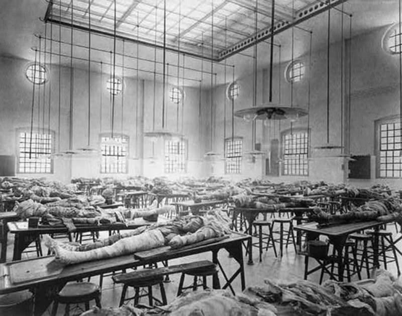 Partially dissected cadavers on tables in the dissecting room at the Jefferson Medical College in Philadelphia, PA, circa 1902.