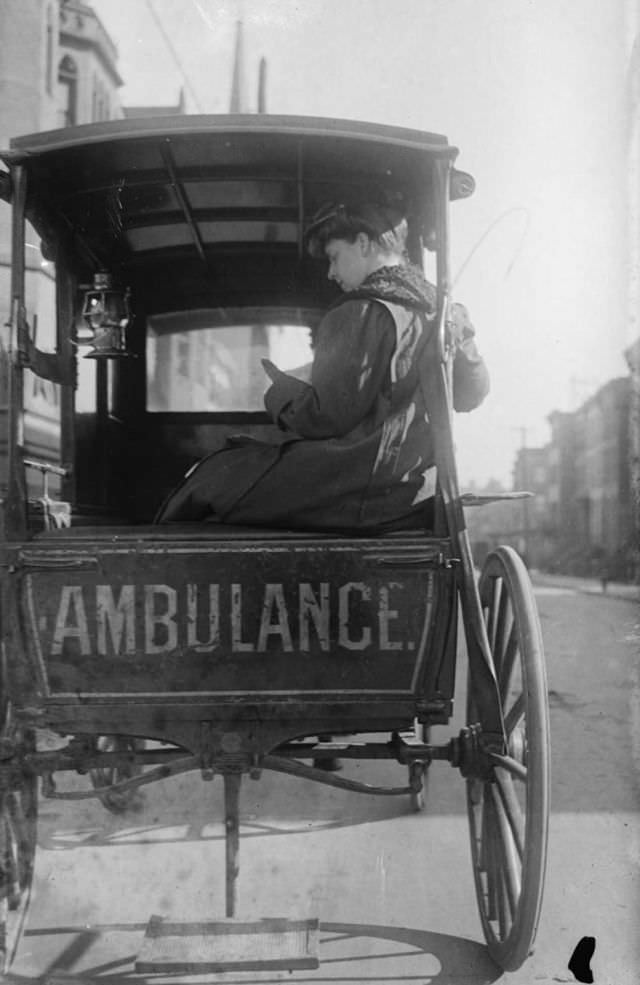Dr. Elizabeth Bruyn sits in the rear of her horse drawn ambulance in the United States, circa 1911.