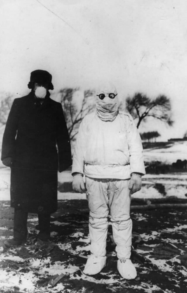 A doctor wears protective clothing during an outbreak of plague in Manchuria, circa 1912.