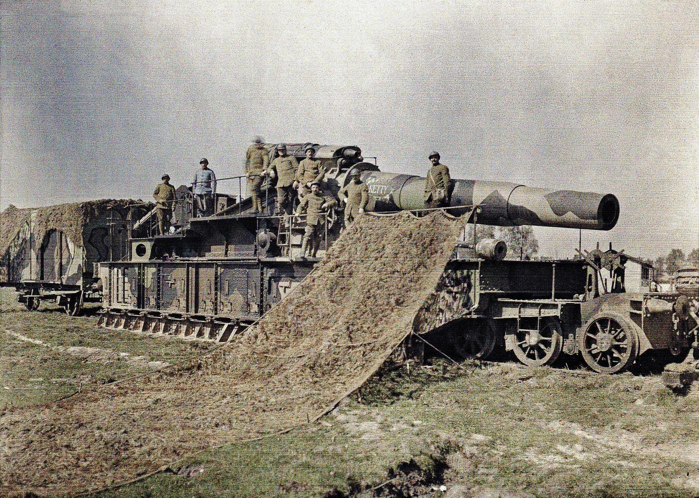 French soldiers camouflaging a 370 mm railway gun named "Keity" in Noyon, Oise region, France, September 5, 1917.