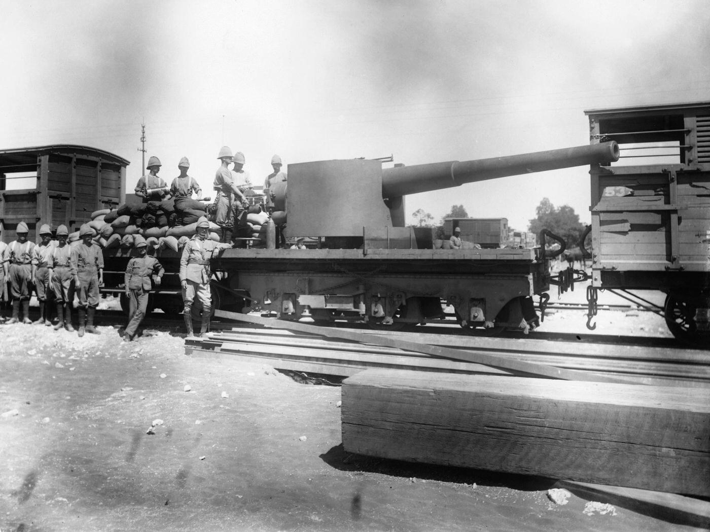 Naval gun on a railway truck being sent forward from Naddier River Station for Lord Roberts' advance.