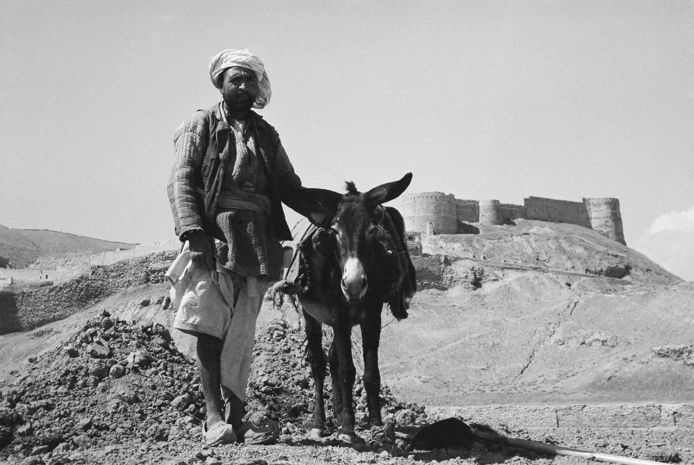 Farmer posing with his donkey near Bella Hesar, Kabul, 1955.