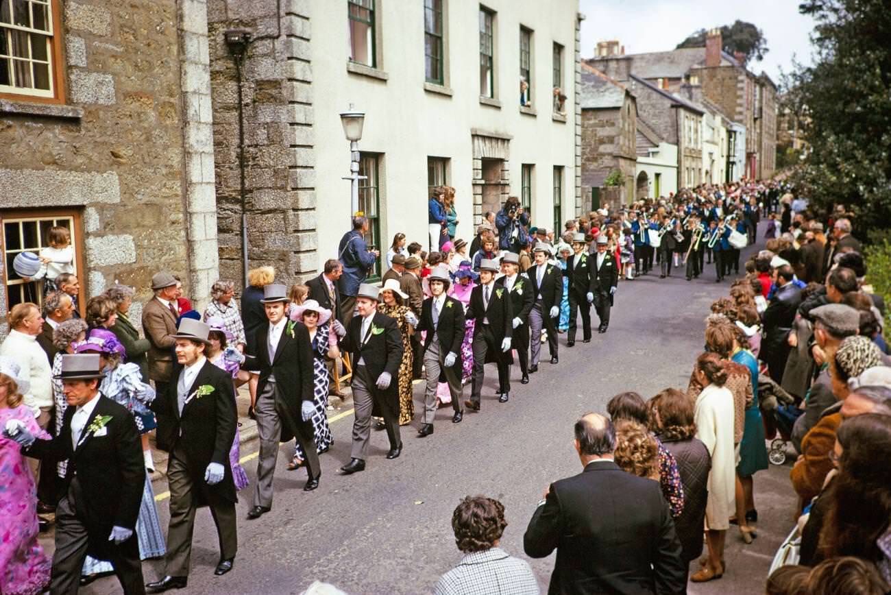 Crowds watch couples perform the Furry dance during Flora Day in Helston, Cornwall, 1973.