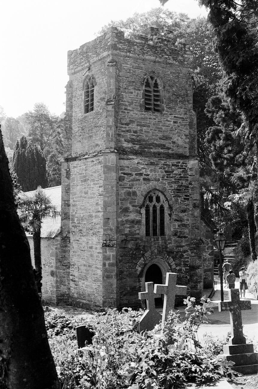 St Just in Roseland Church, a 13th-century church set in riverside gardens with semitropical shrubs and trees, Cornwall.