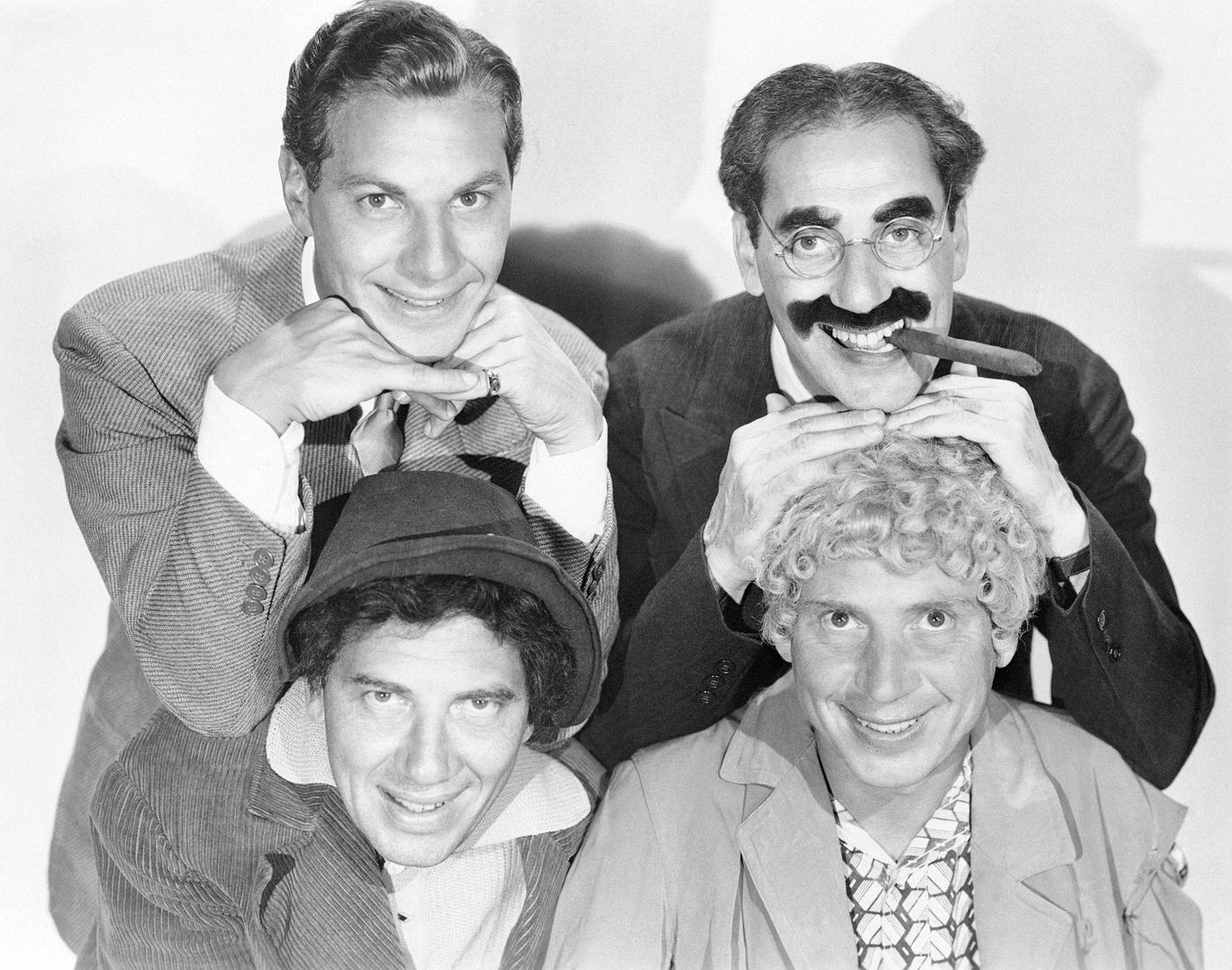 The Marx Brothers in character for Duck Soup (1933): Zeppo as Lt. Bob Roland, Groucho as Rufus T. Firefly, Harpo as Pinky, and Chico as Chicolini.