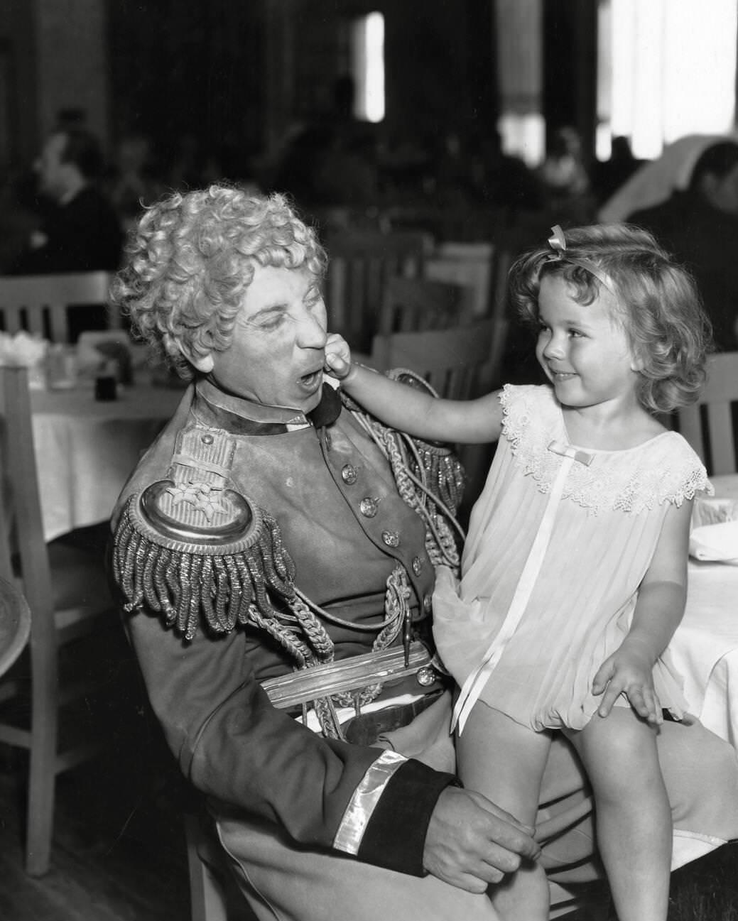 Harpo Marx with Shirley Temple in Duck Soup (1933).