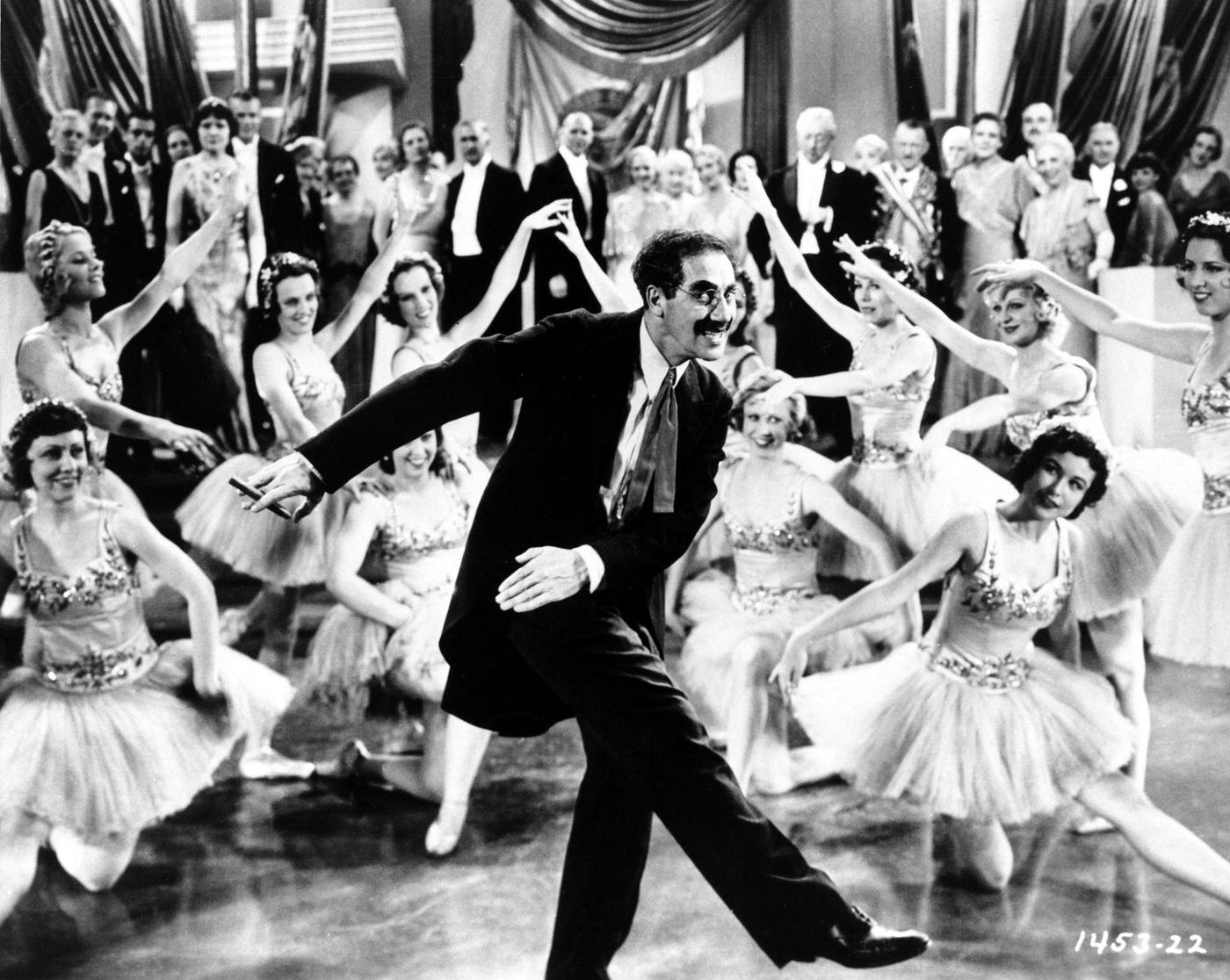 Groucho Marx dances with ballerinas in a scene from Duck Soup (1933) in Los Angeles, California.