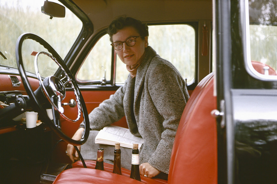 Woman in the Mercedes 180D somewhere along the Rhine River, 24 June 1958