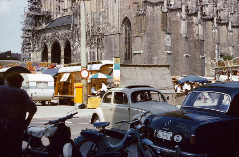 A carnival set up in front of the Minster in Ulm, Germany, , 1960s