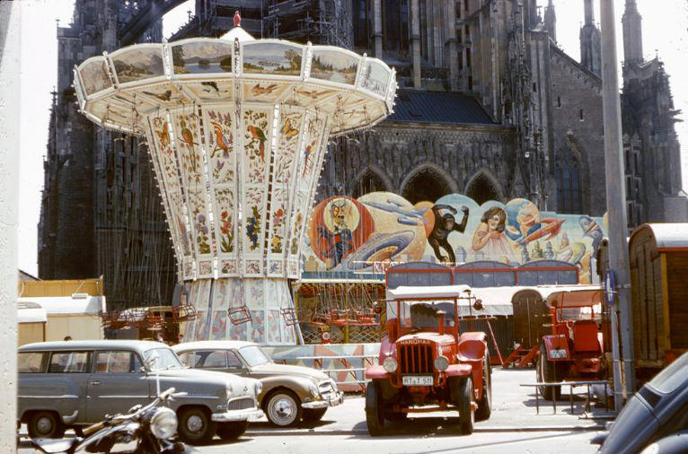 A carnival set up in front of the Minster in Ulm, Germany, , 1960s