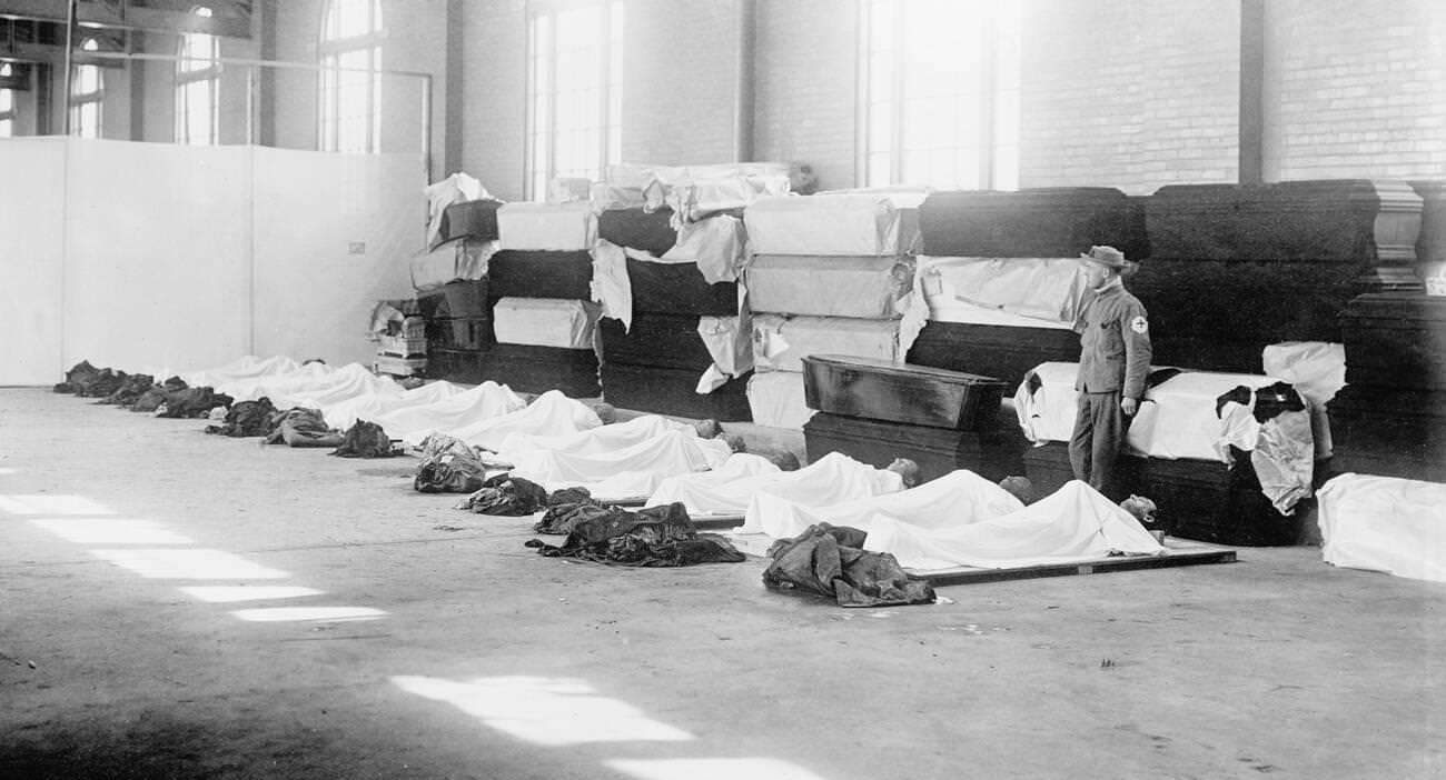 Corpses laying on the floor with coffins lining the wall, Great Dayton Flood, 1913