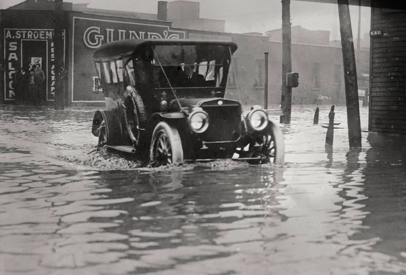 Automobile trying to get through the flood waters during the Great Flood of 1913 in Cleveland, Ohio.