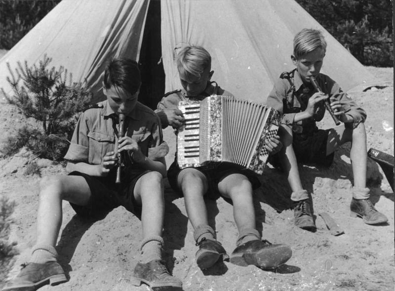 Hitler Youth members playing musical instruments, 1930s.