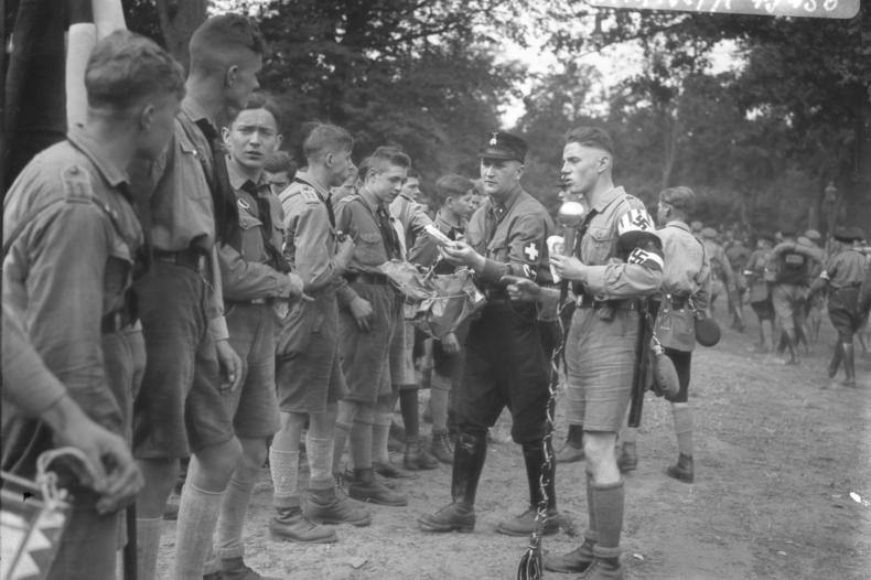 Members of Hitler Youth receiving rations at a camp near Potsdam, Germany, 1932.
