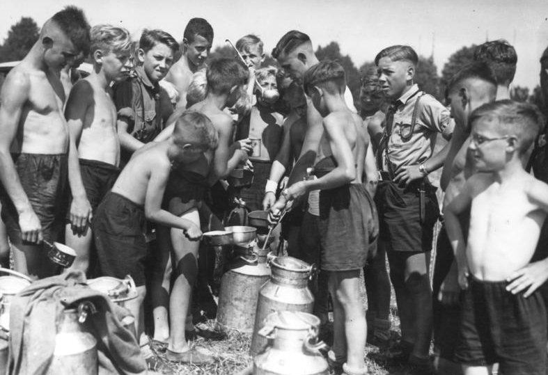 Meal time at a Hitler Youth camp, Germany, 1930s.