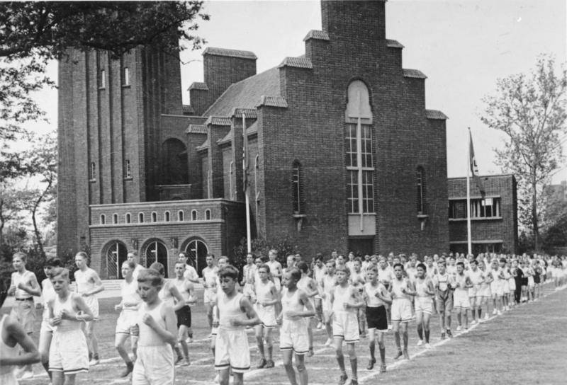 Hitler Youth members exercising near the German Evangelical Church in Shanghai, China, 1 May 1936.