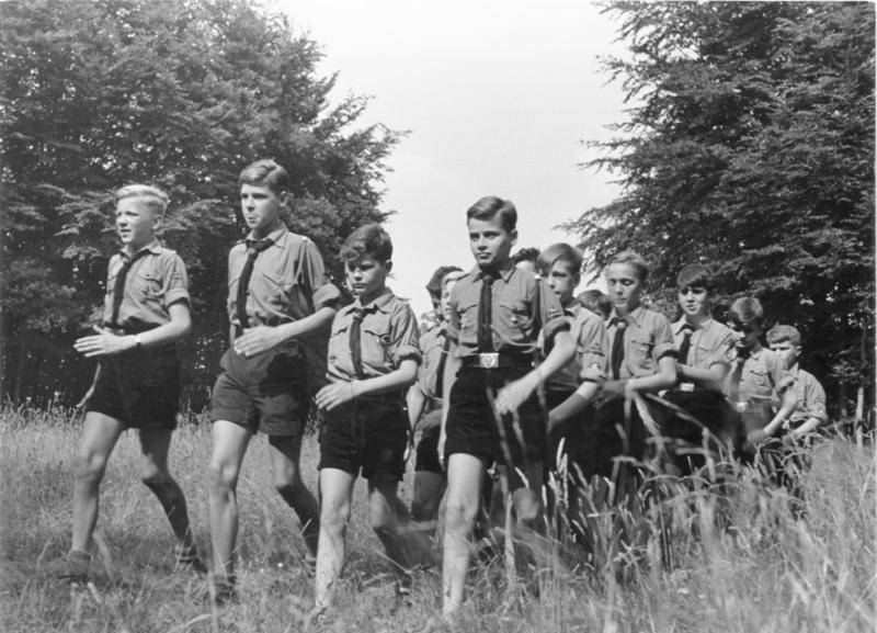 Hitler Youth members on a hike through woods