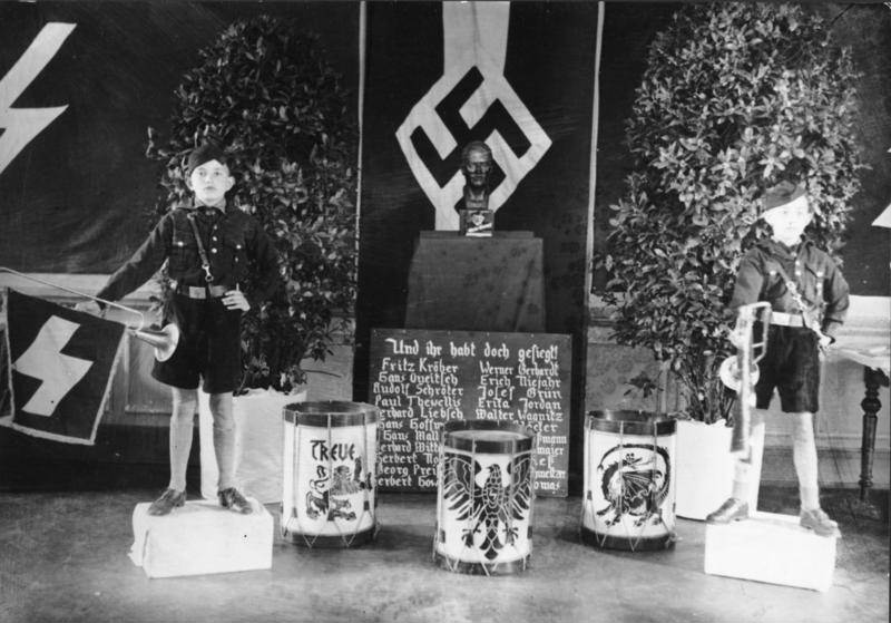 Hitler Youth members standing guard at an altar for fallen soldiers