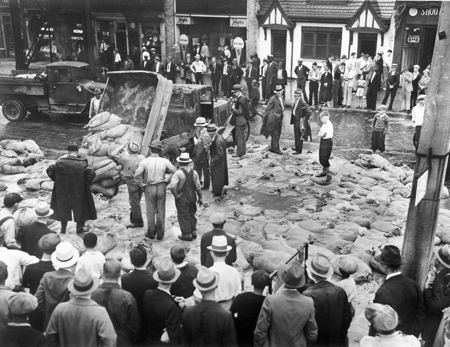 Heavy rain caused the James River to crest at 26 feet. City workmen piled sandbags in a desperate attempt to hold back the rising waters, 1935.