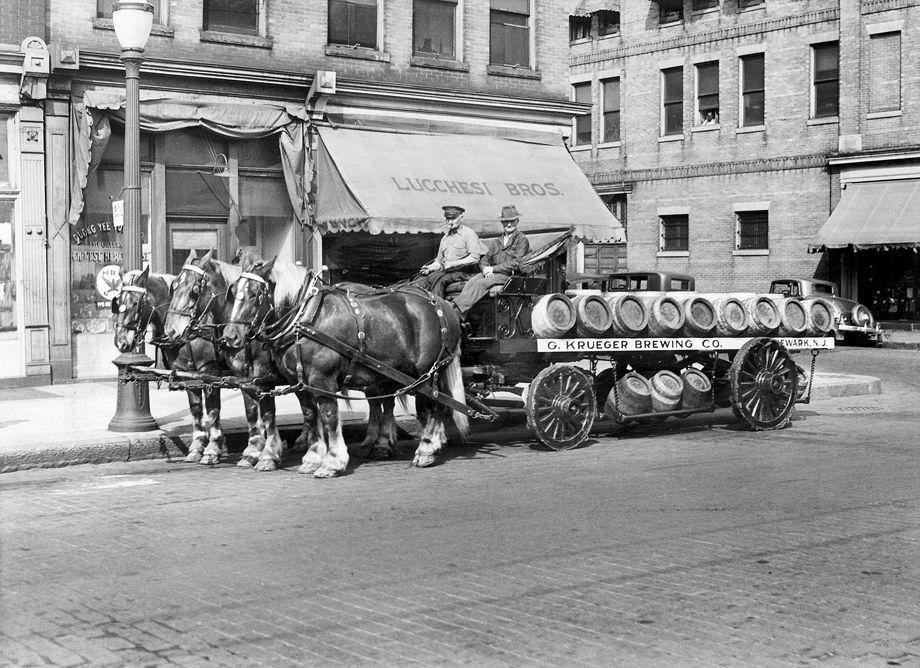 Workers from G. Krueger Brewing Co. transported beer barrels on West Broad Street in Richmond, 1934.