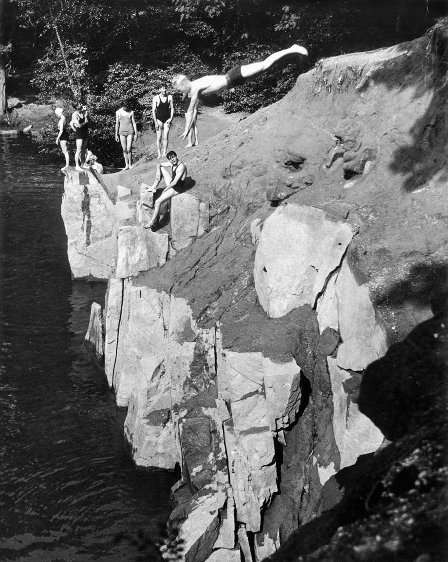 Teenagers enjoyed swimming and diving off rocks at the Bryan Park quarries in Richmond, 1934.