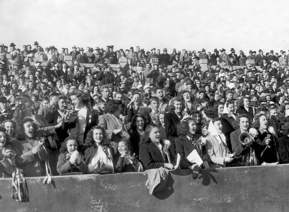 Female fans wearing the red and white of Thomas Jefferson High School were part of a crowd of 17,000 who watched Teejay beat John Marshall High 6-0 in the Prep Classic at City Stadium in Richmond, 1946.