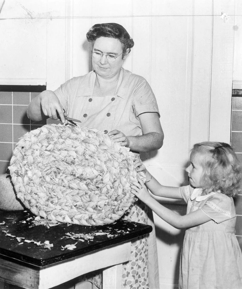 Mrs. James Hicks of James City County and her daughter, Willie Mae, made a cornhusk doormat at home, 1949.