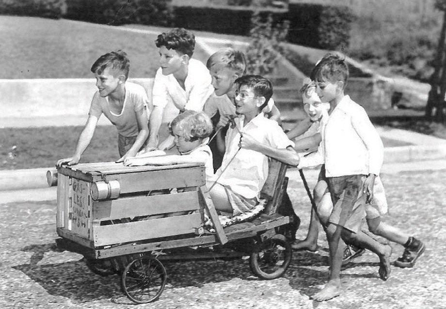 Children took a homemade cart for a spin along North 19th Street in Richmond, 1941.