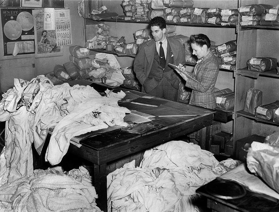 Richmond lawyer Robert R. Merhige Jr. worked with his secretary, Mrs. Robert Wagner, to conduct inventory at a laundry on North Addison Street for which he had been appointed receiver, 1945.