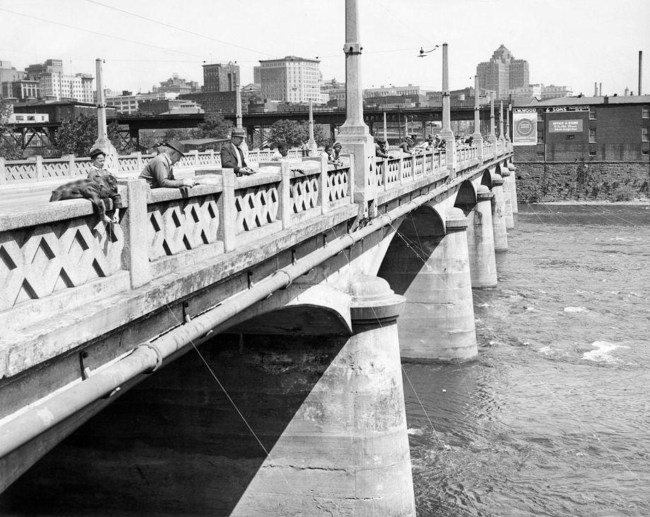 Fishing enthusiasts came out to enjoy the bright sunshine on the Mayo Bridge in downtown Richmond, 1946. High temperatures matched the 1925 record of 90 degrees.