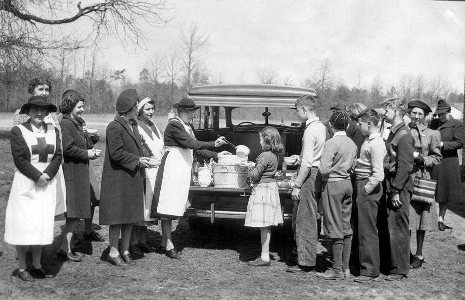 Mrs. Tazewell Perrow served soup to children from Bon Air School from the first mobile canteen for Chesterfield County, 1942.