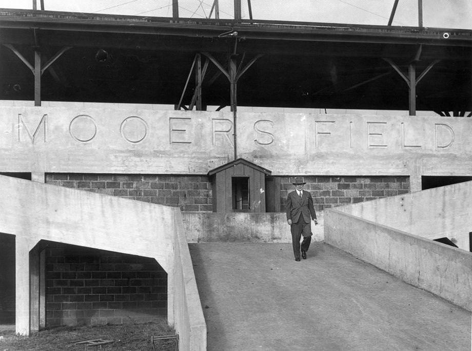 Team owner Eddie Mooers standing outside his baseball park, 1949.