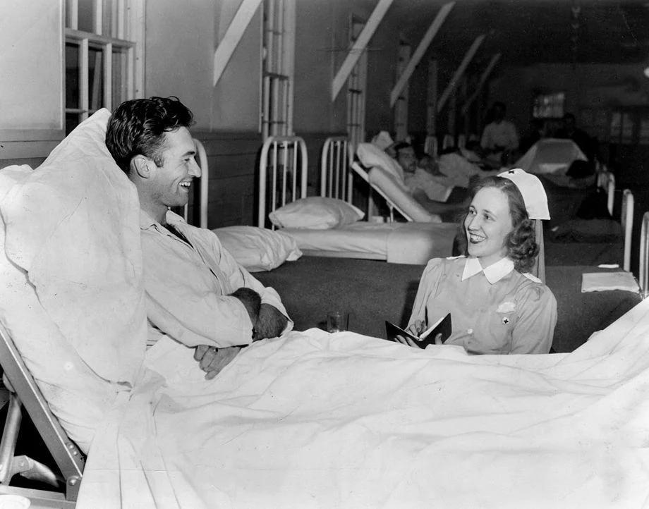 Mrs. Frank Sloan of the Red Cross took dictation from soldier Robert Parks in the convalescent ward at the Camp Lee Hospital in Prince George County, 1941.