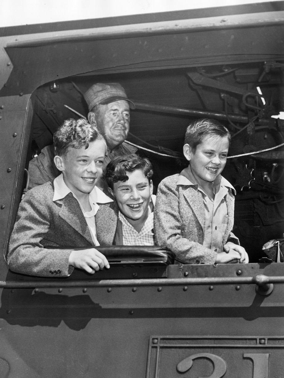 The Quiz Kids learned about railroading from RF&P engineer C.W. Shackleford (rear) during their visit to Richmond to help sell war bonds during World War II, 1943.