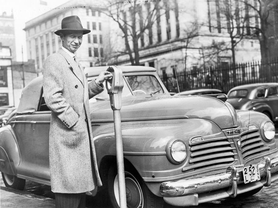 A. Edward Campbell, state campaign manager for the United Service Organization, stood beside his new car, 1942.