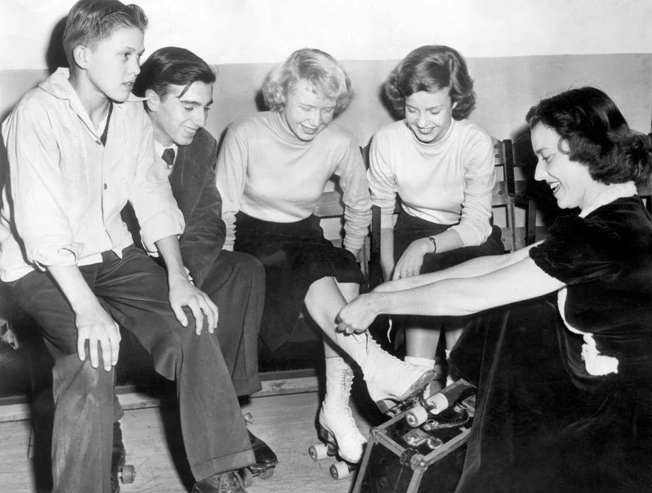 Richmond teens put on their roller skates at the Cavalier Arena with some help from city recreation department employee Jane Hemby, 1948.
