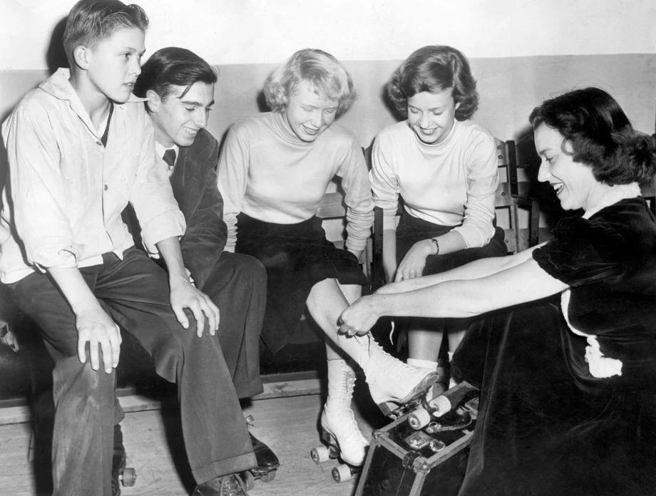 Richmond teens put on their roller skates at the Cavalier Arena with some help from city recreation department employee Jane Hemby, 1948.