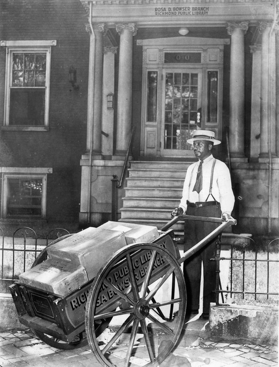 Manpower and a cart were a means of transporting new books to the Rosa D. Bowser Branch of the Richmond library during the gas-rationing days of World War II, 1942.