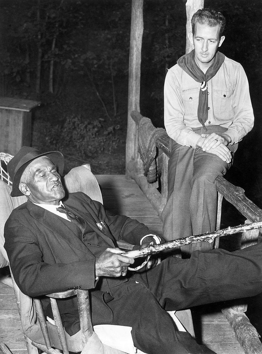 85-year-old B.W. Partee (seated), caretaker at Camp Shawondasee in Chesterfield County for 26 years, was ready to retire, 1947.