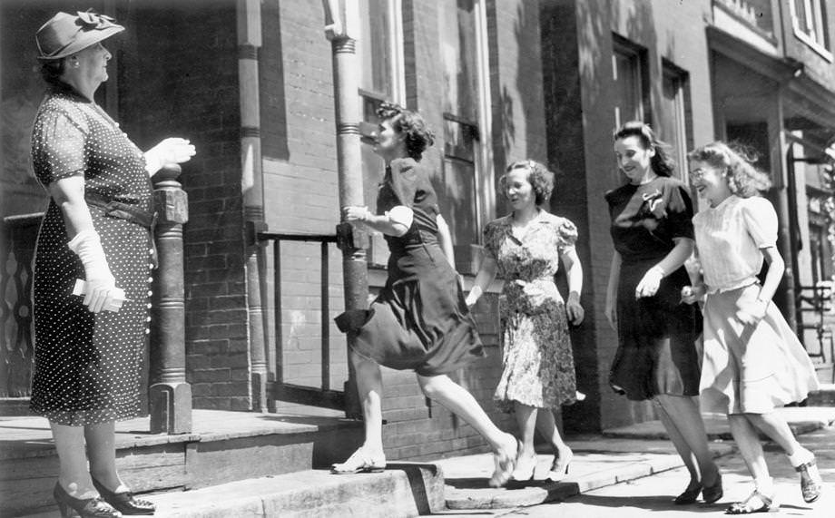 Mrs. P.M. Edwards directed a group of women to a shelter during a daylight air raid test in Richmond, 1942.