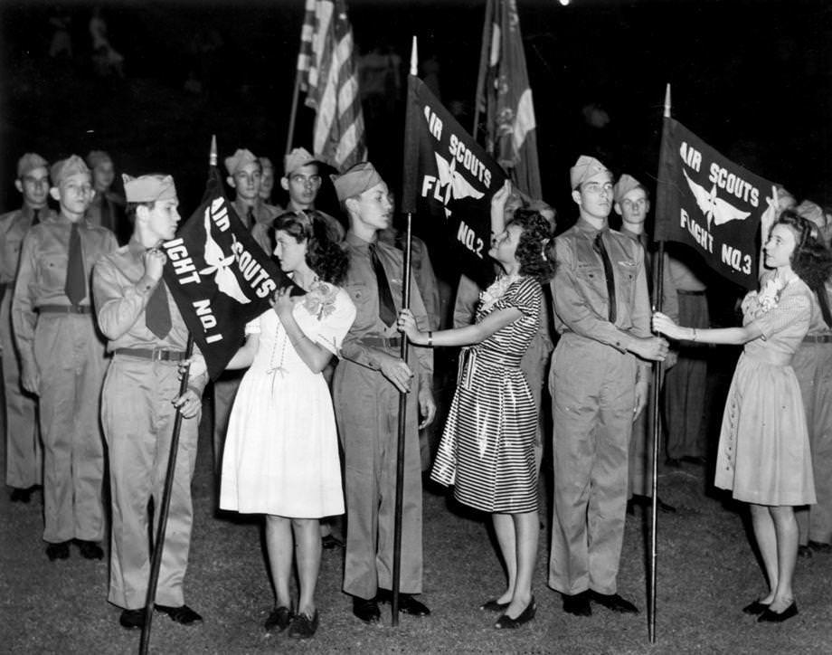 Leaders of the three flights in the Gamble’s Hill Community Center Air Scouts received their banners at the first review of the corps held in Gamble's Hill Park, 1946.