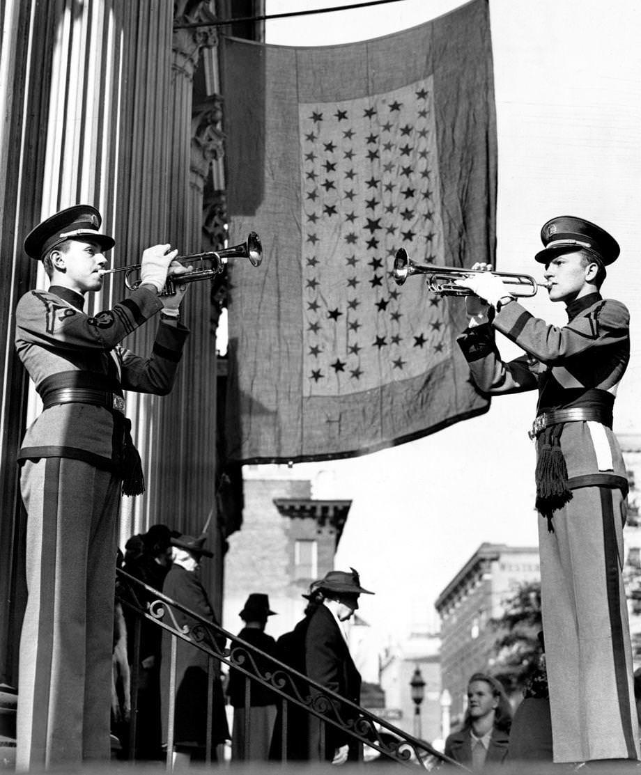 John Marshall High School cadet sergeants M. Cohen and J.C. Fuquay played taps during a service on Armistice Day at St. Paul’s Episcopal Church in Richmond, 1942.