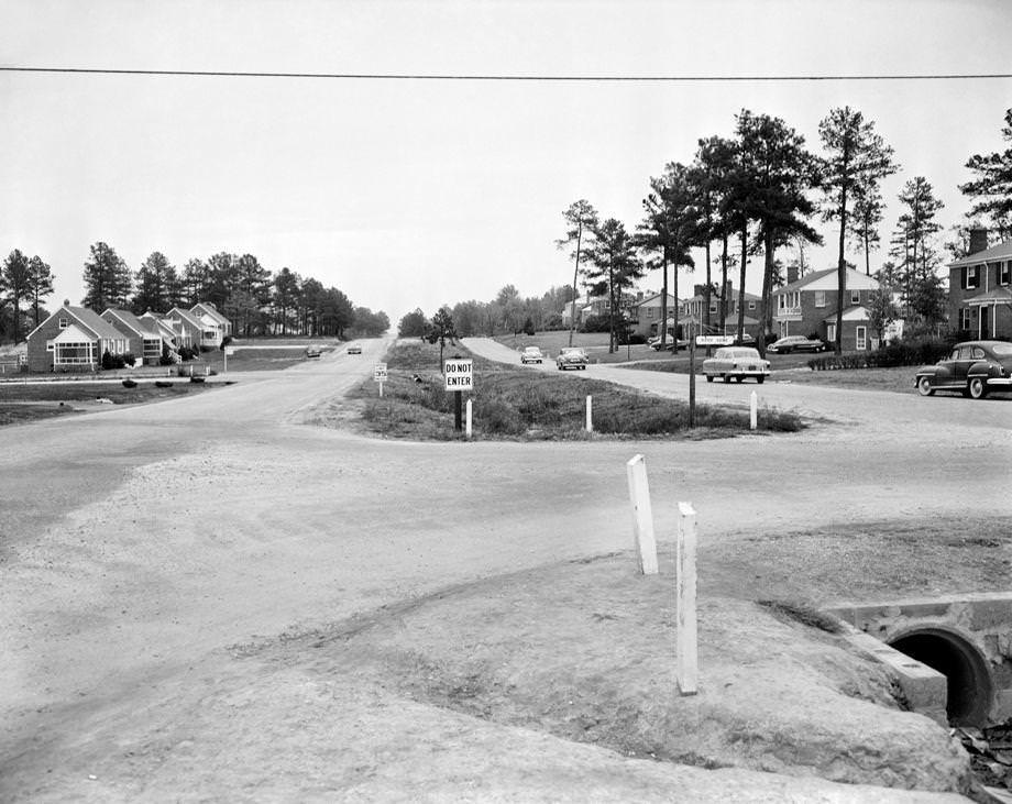 A 10-block section of Monument Avenue between Horsepen Road and Keystone Drive in Henrico County began carrying eastbound and westbound traffic on separate sides of the median, 1953.