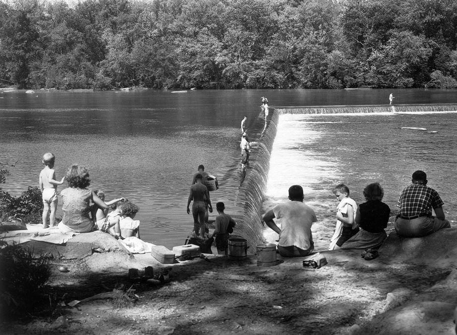Area residents enjoyed a refreshing swim in the James River — a reprieve from record high temperatures during the spring month, 1956.