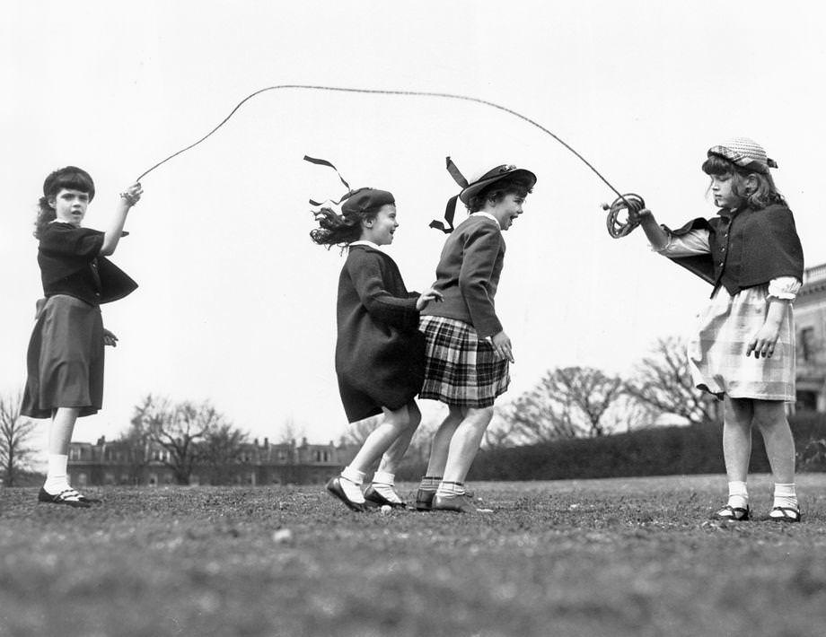 Four girls played jump-rope in a Richmond city park, 1950.